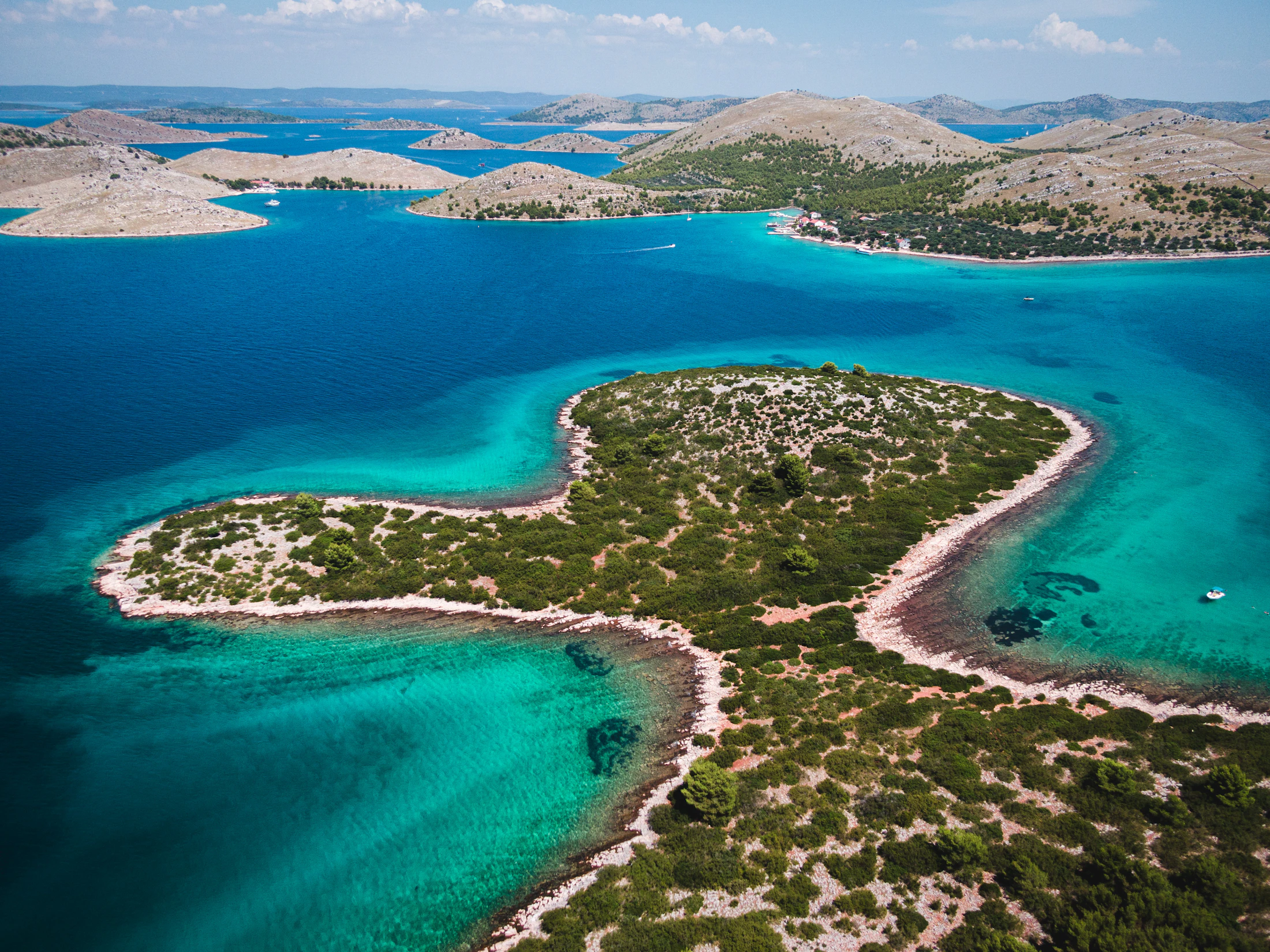 Turquoise Adriatic water winding between rocky Croatian islands